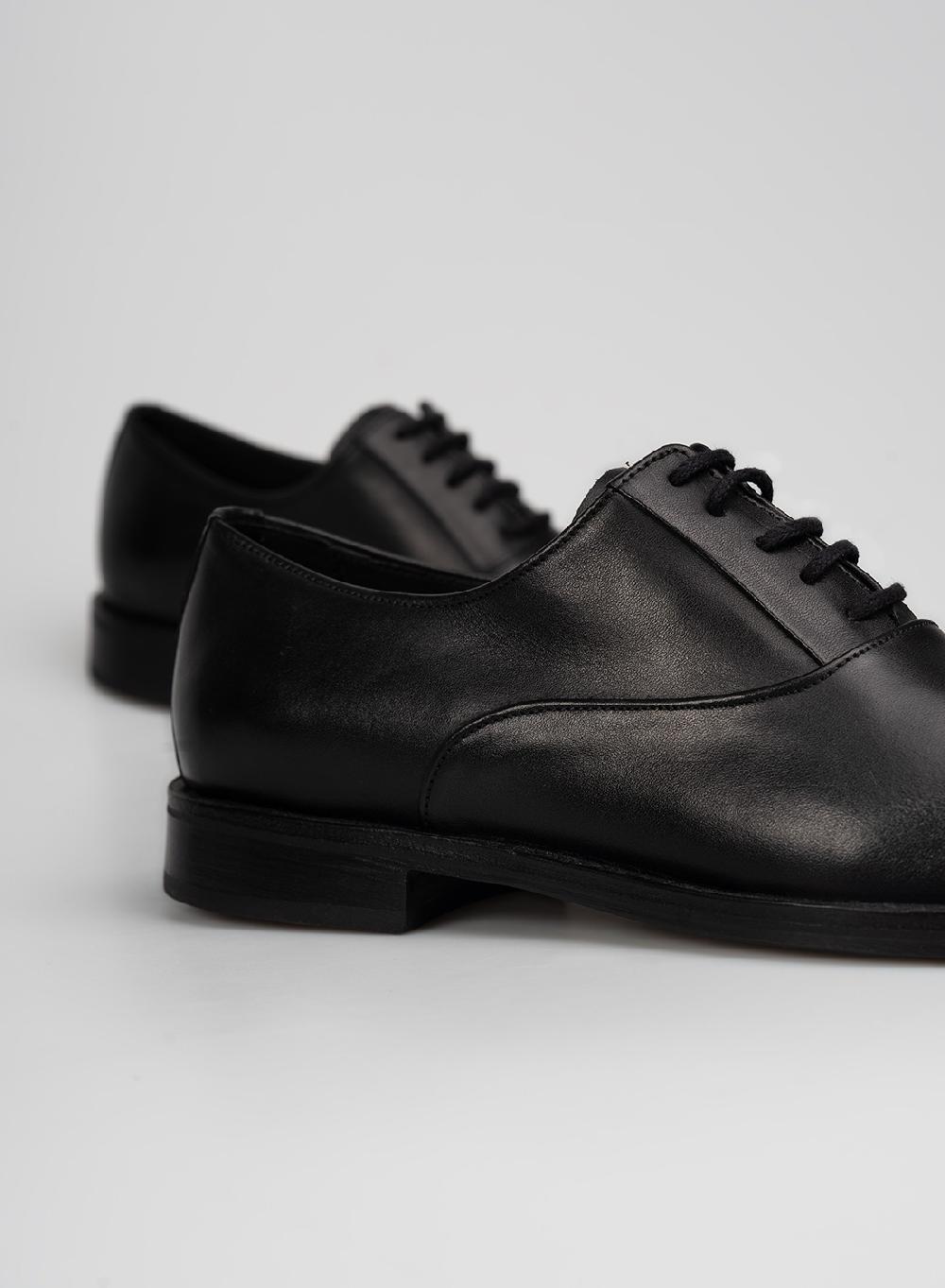 Etiqueta negra Zapato Abotinado Devoluciones gratuitas