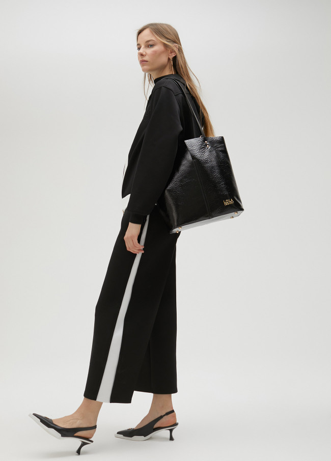 lola casademunt Pantalón negro y blanco en lateral Libre de impuestos