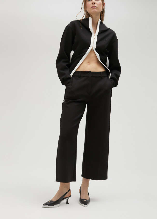 lola casademunt Pantalón negro y blanco en lateral Libre de impuestos