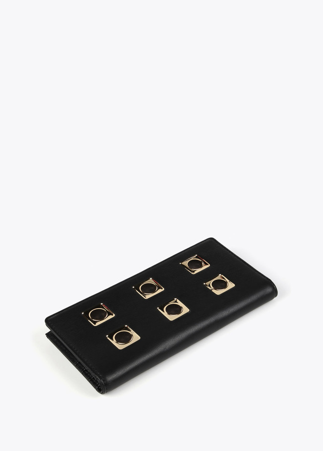 lola casademunt Billetero negro y dorado Ahorra y exporta