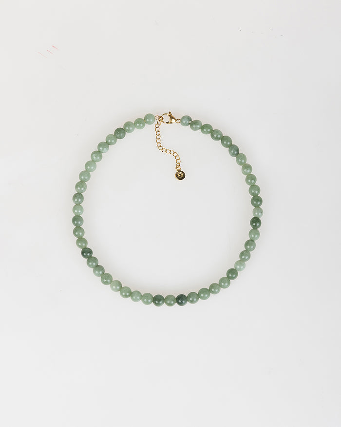system action Collar de perlas verdes