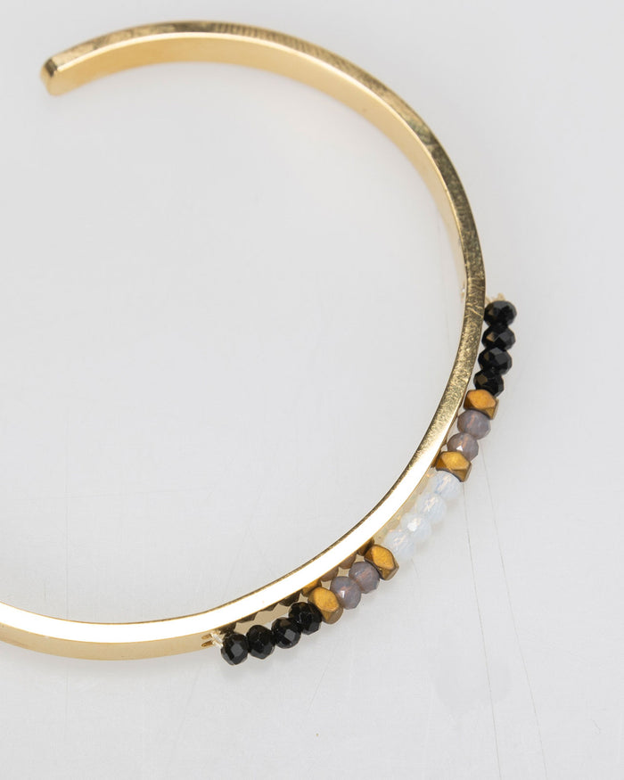 system action Pulsera rígida semi abierta detalle pedrería en centro Solo queda un día