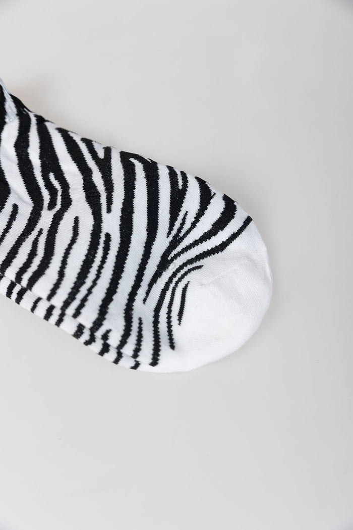 system action Calcetines animal print cebra Limitado a 3 días
