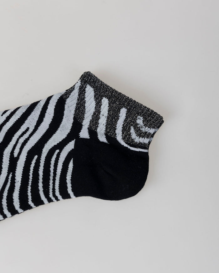 system action Calcetines animal print cebra Limitado a 3 días