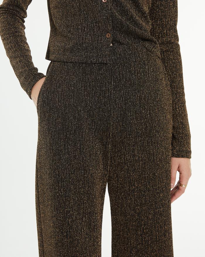 system action Pantalón largo evasé con brillo Tienda de fábrica