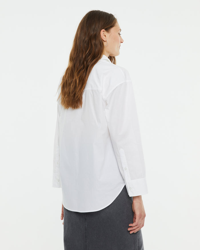 system action Camisa masculina popelín oversize Promoción trimestral