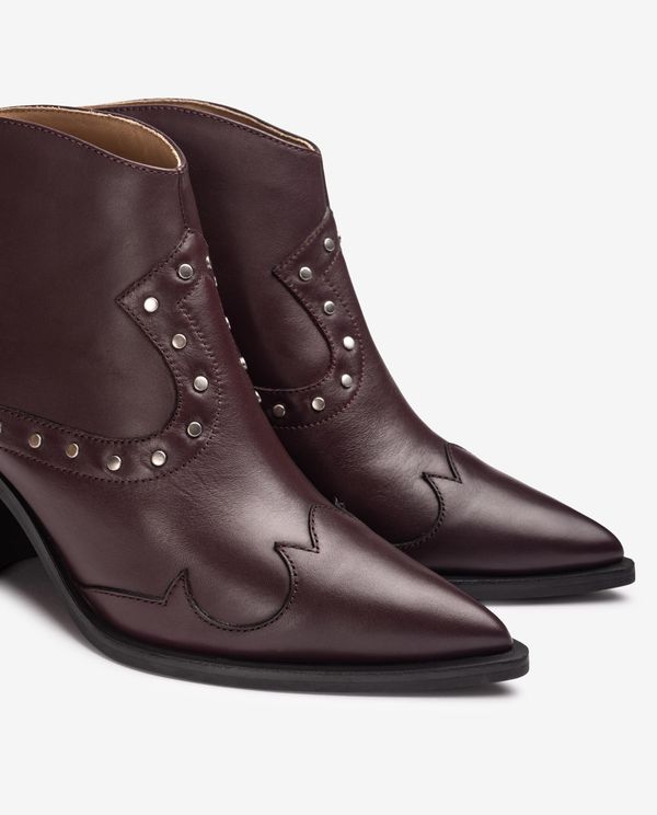 unisa Botín cowboy con tachuelas Devoluciones gratuitas