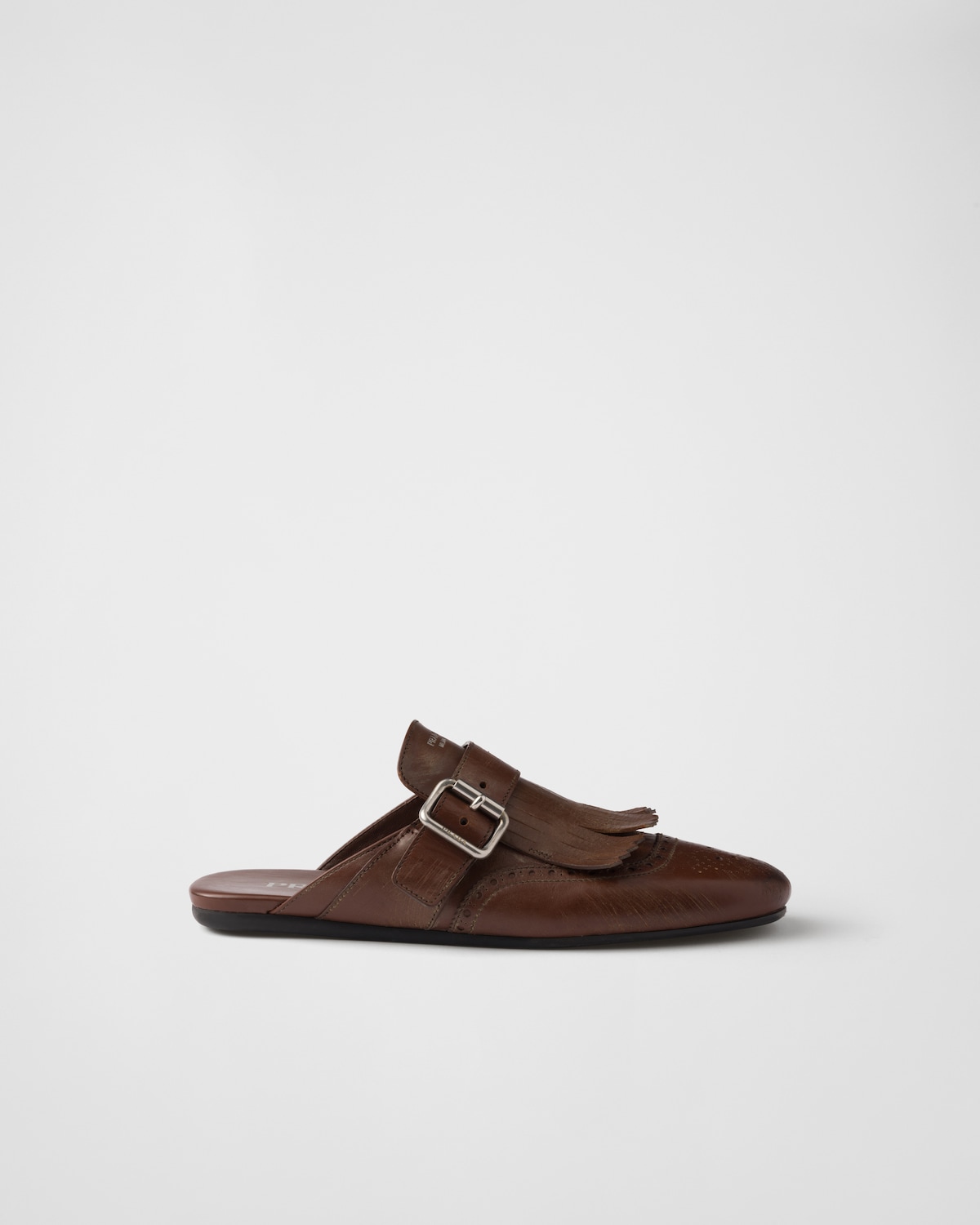 Prada Mules Shuffle de piel con flecos