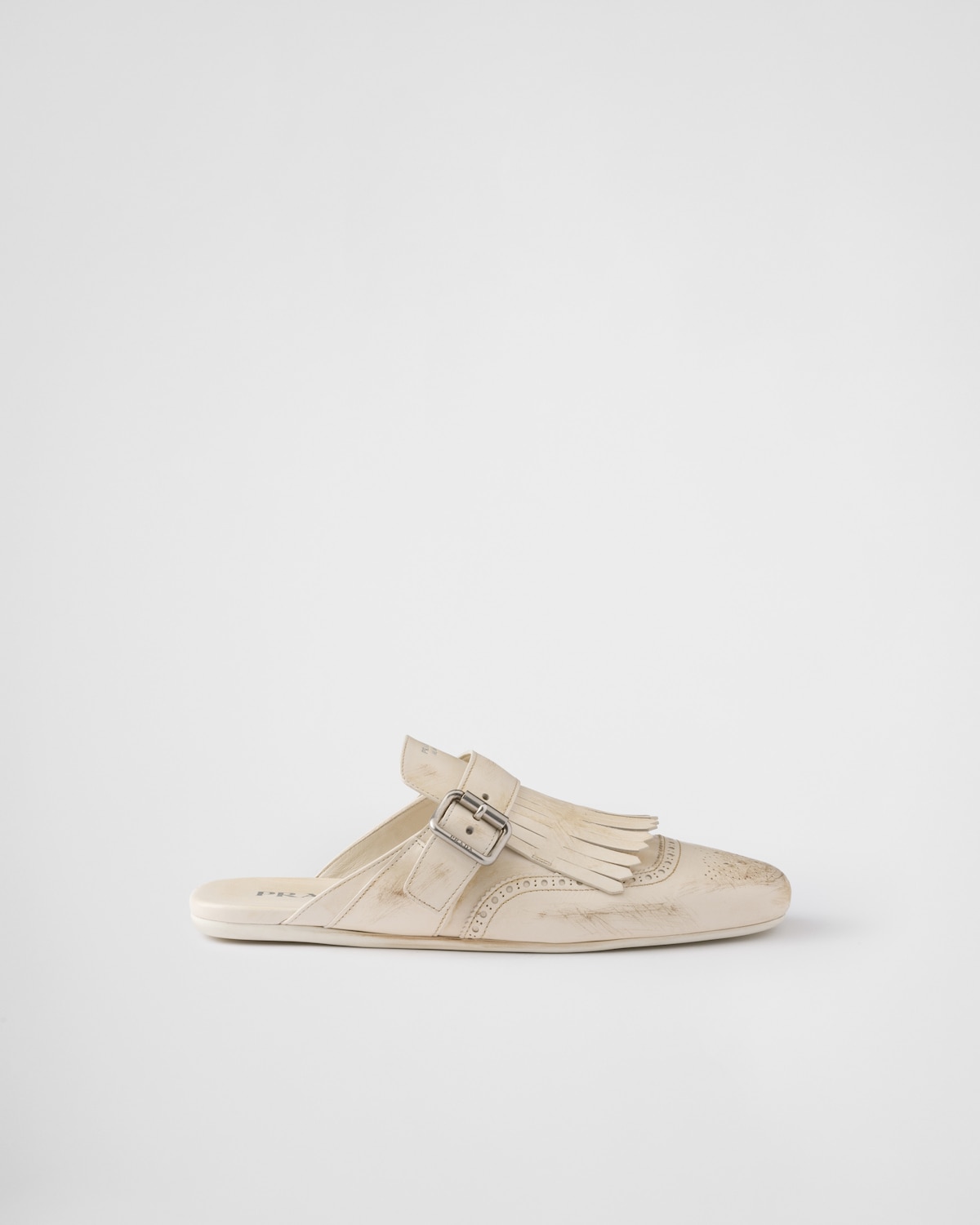 Prada Mules Shuffle de piel con flecos