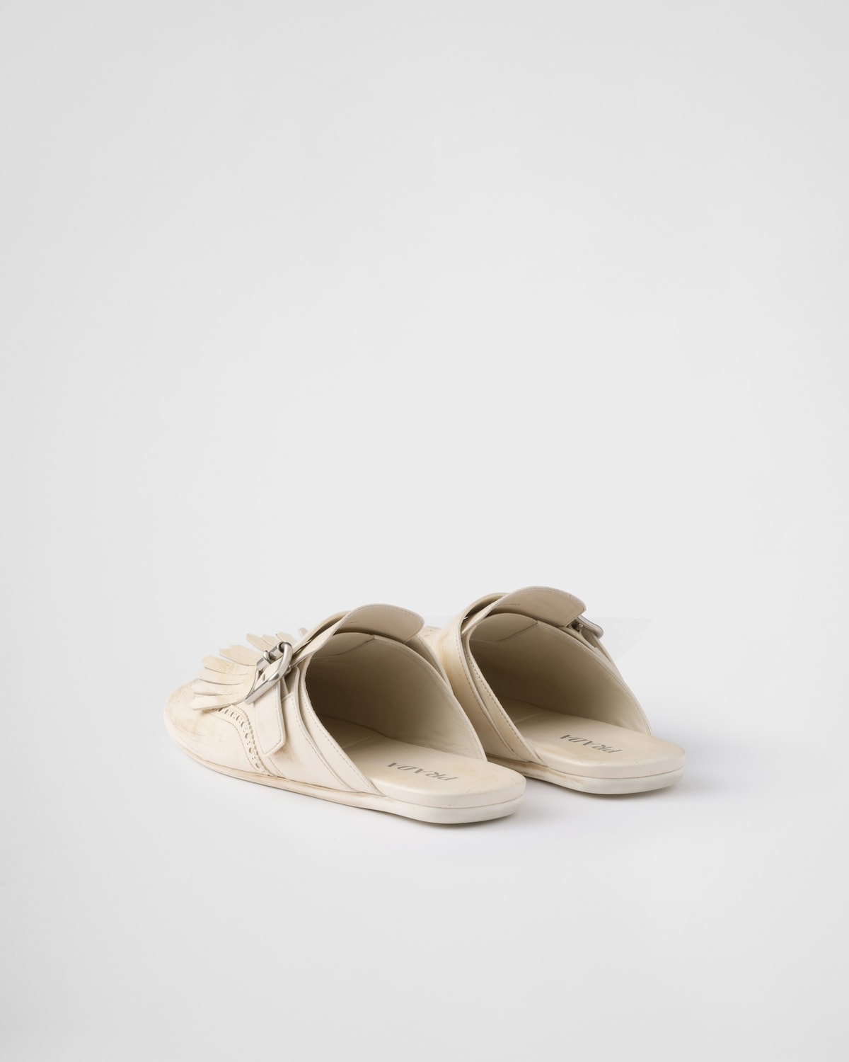 Prada Mules Shuffle de piel con flecos Descuentos del mes