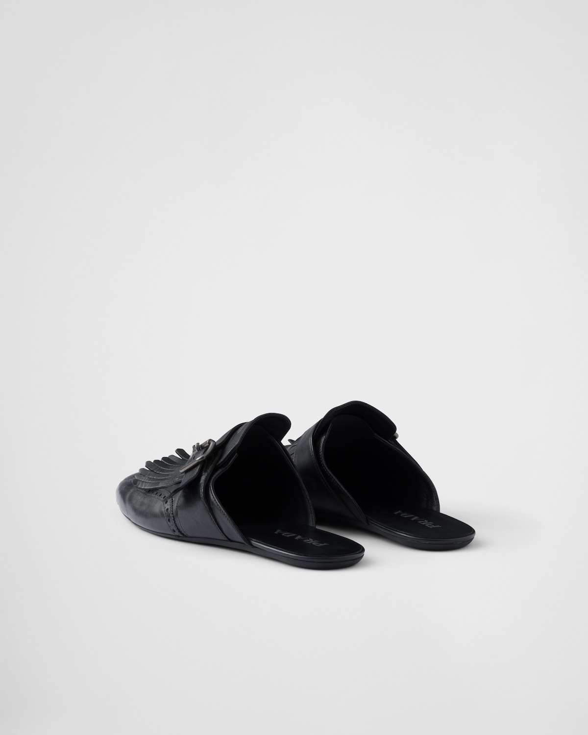 Prada Mules Shuffle de piel con flecos y correa de hebilla ÚLTIMAS EDICIONES