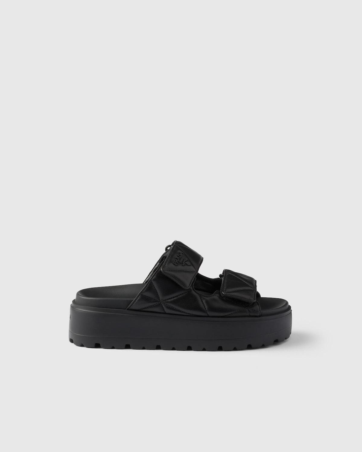 Prada Sandalias planas de napa acolchada