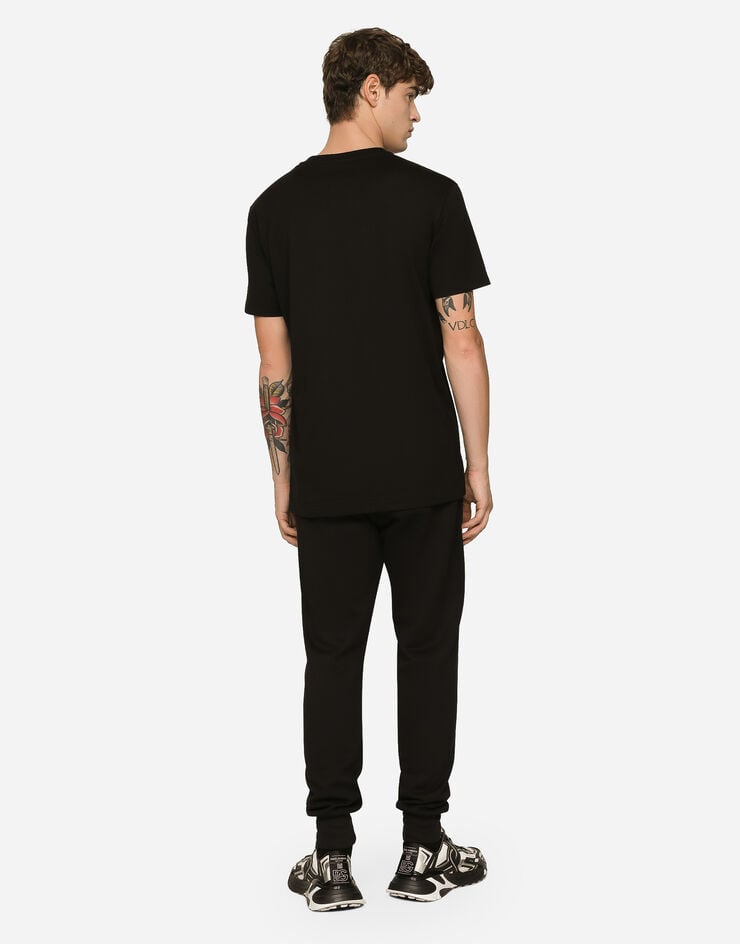 Dolce & Gabbana Pantalón de chándal en punto con estampado del logotipo DG Venta caliente