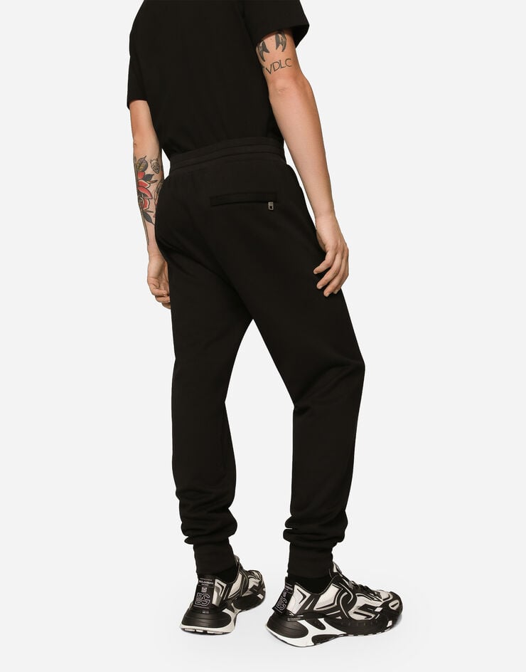Dolce & Gabbana Pantalón de chándal en punto con estampado del logotipo DG Venta caliente