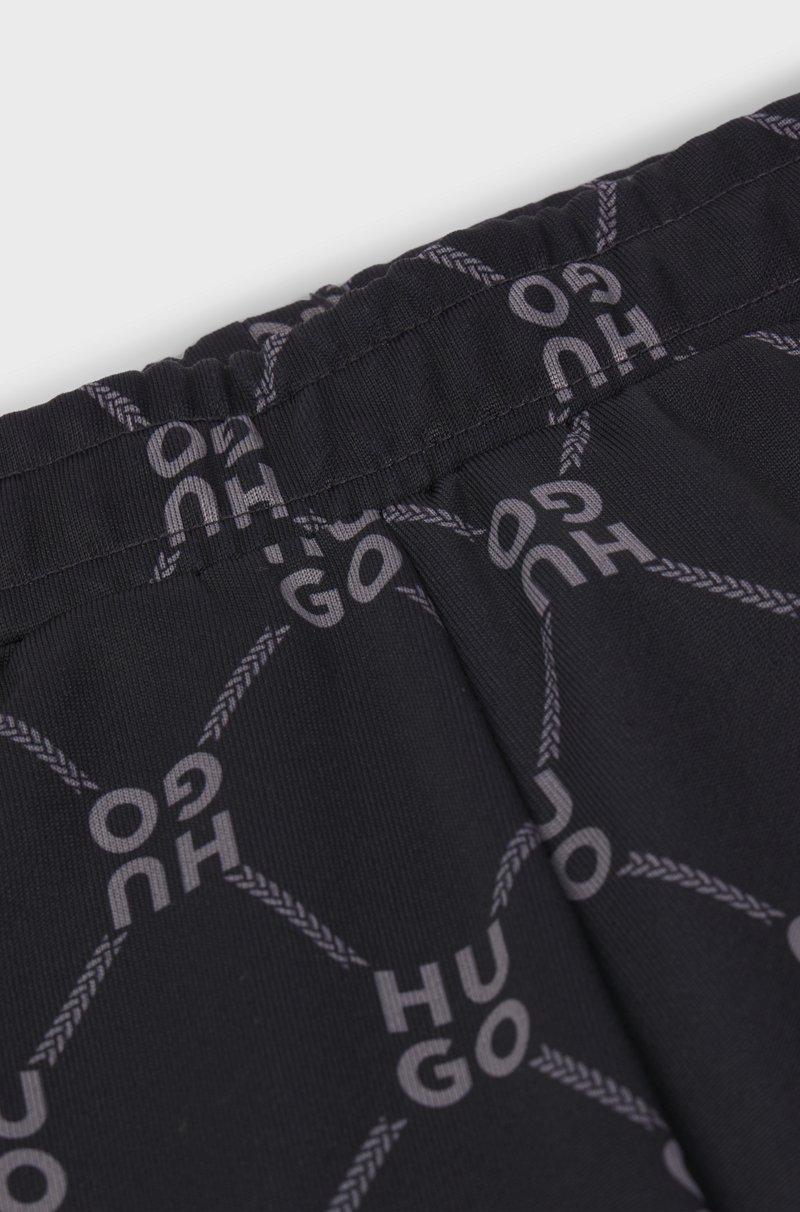 Hugo Boss Pantalones de chándal loose fit para niños con logo apilado estampado Devoluciones gratuitas