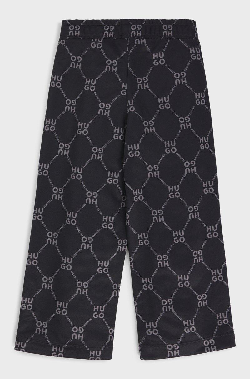 Hugo Boss Pantalones de chándal loose fit para niños con logo apilado estampado Devoluciones gratuitas