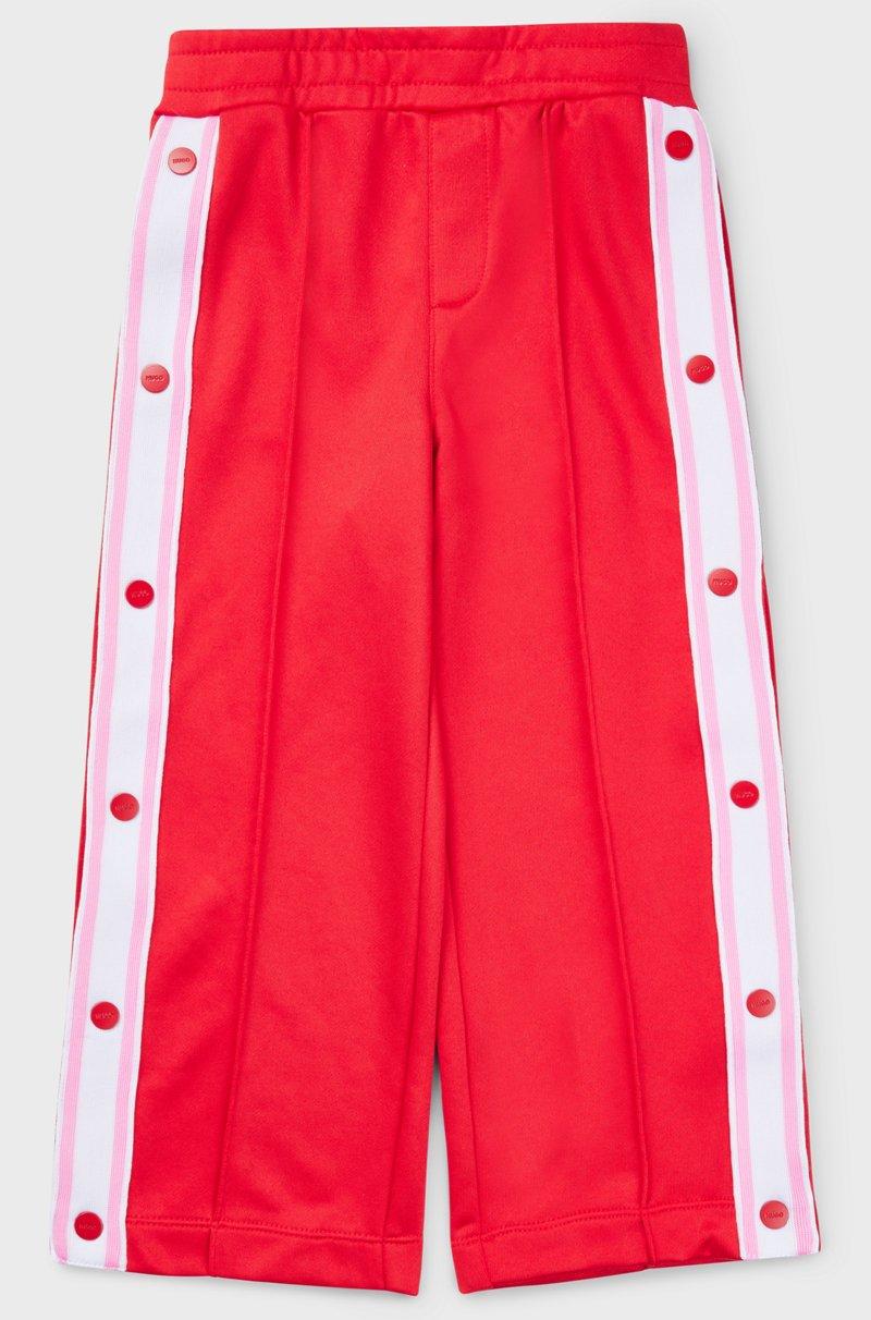 Hugo Boss Pantalones de chándal para niños con botones automáticos en las costuras laterales