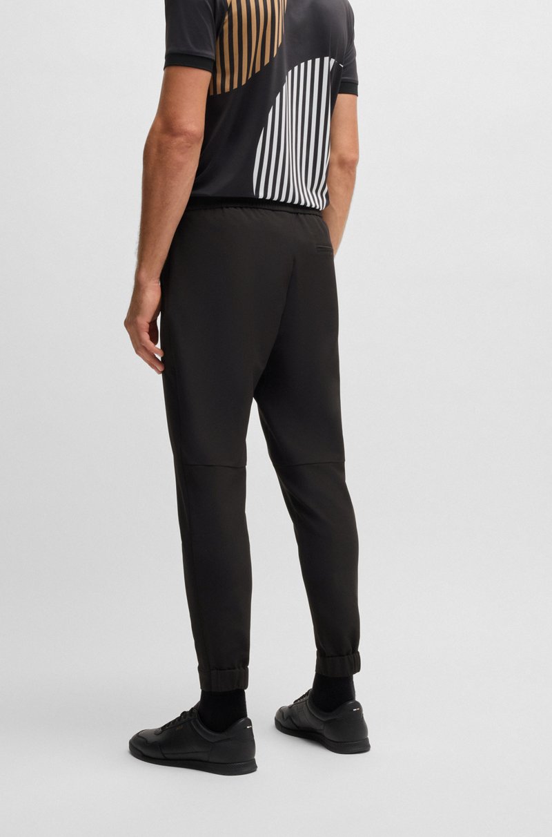 Hugo Boss Pantalones tapered fit de tejido elástico repelente al agua Descuentos del mes