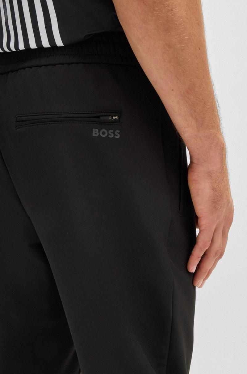 Hugo Boss Pantalones tapered fit de tejido elástico repelente al agua Descuentos del mes