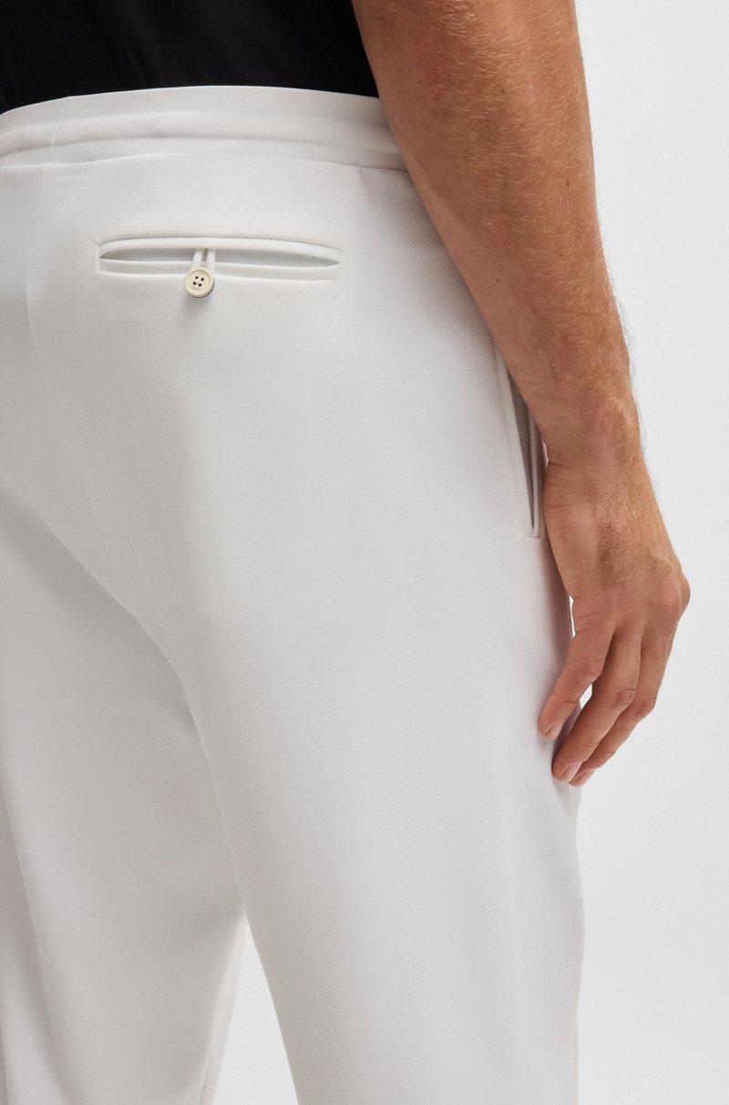 Hugo Boss Pantalones regular fit en tejido de gabardina elástico con detalle de logo Venta caliente