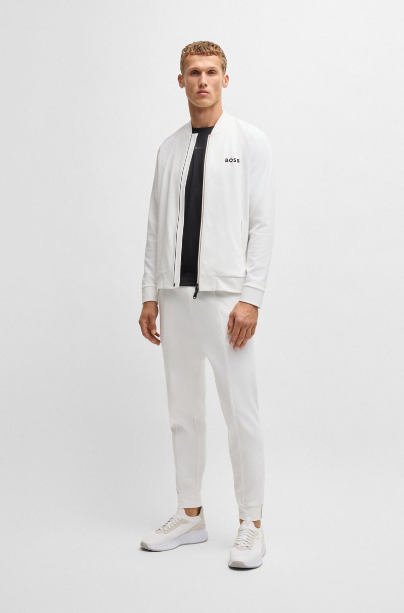 Hugo Boss Pantalones regular fit en tejido de gabardina elástico con detalle de logo Venta caliente