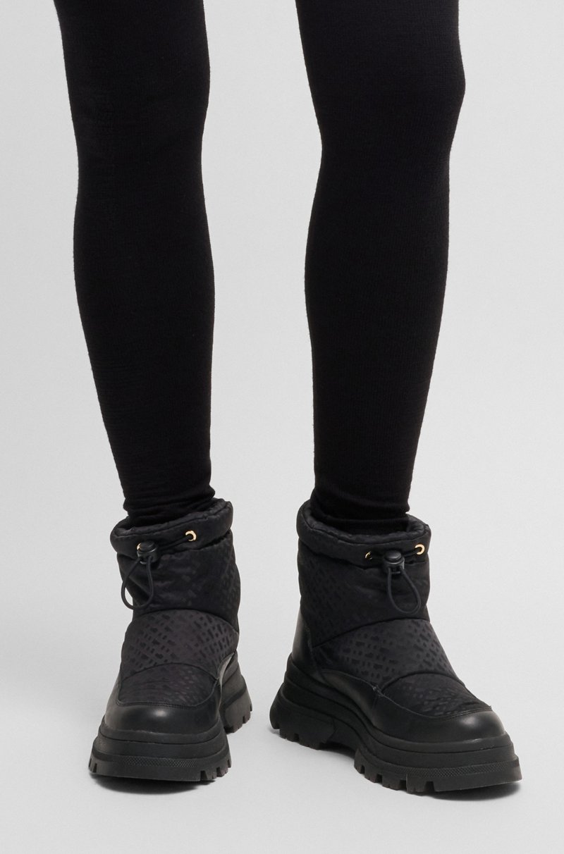 Hugo Boss Botas slim fit con motivo de monogramas y apliques de piel Envío gratis