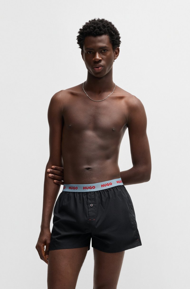 Hugo Boss Paquete de tres calzoncillos bóxer de algodón con logos en la cintura Envío internacional gratuito