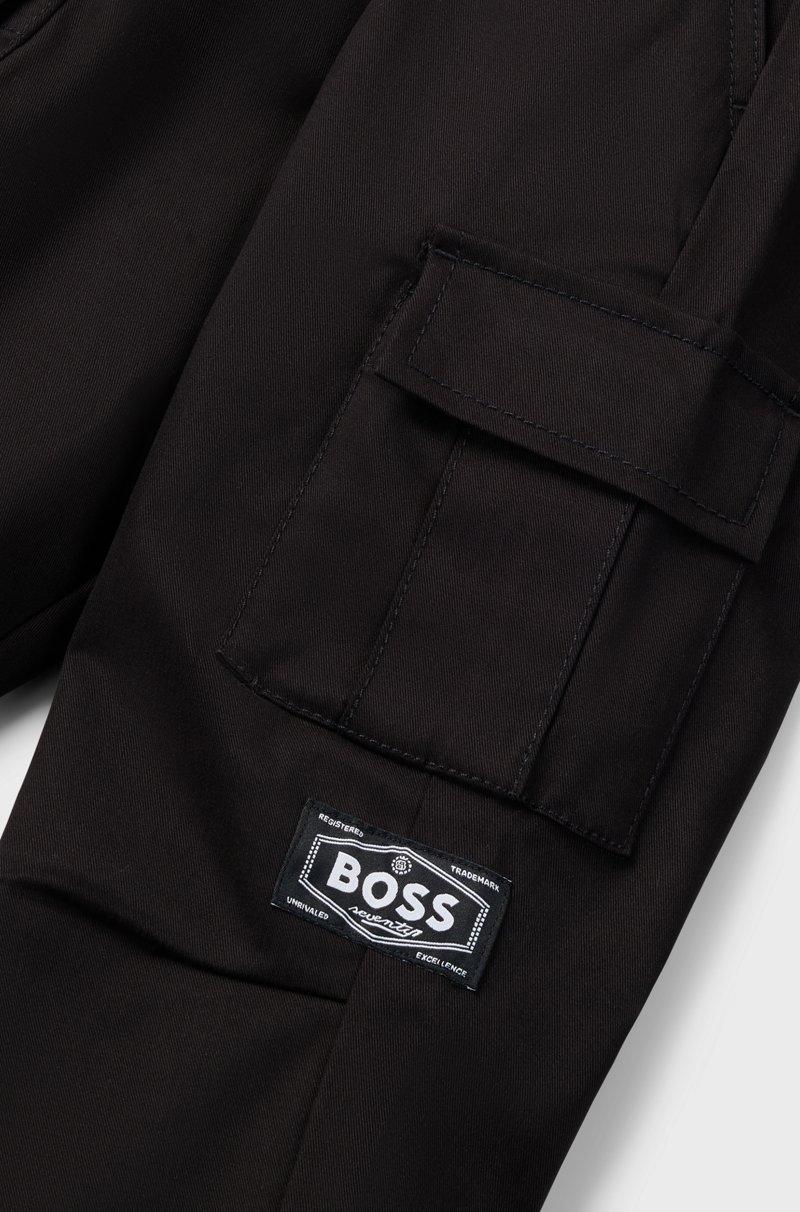 Hugo Boss Pantalones tapered fit en sarga de algodón elástico para niños Solo hoy