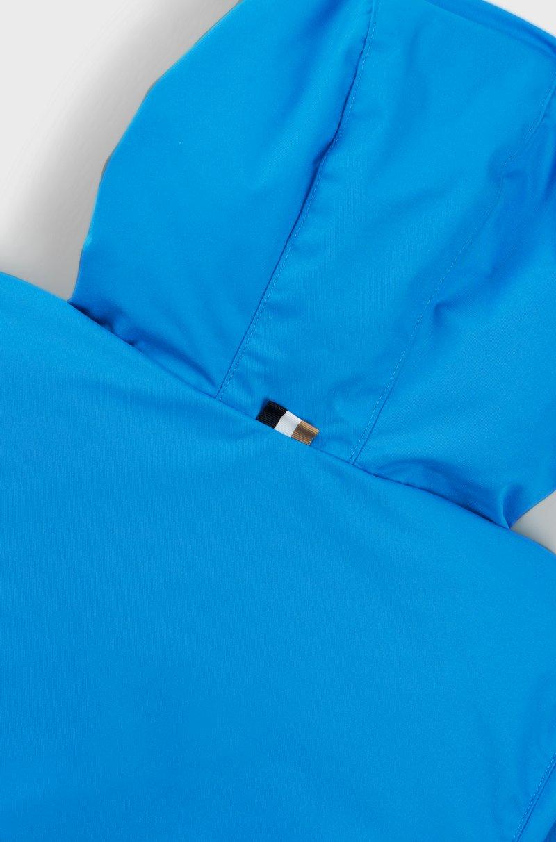 Hugo Boss Cazadora cortavientos para niños con bloques de color y estampado de monogramas que aparece con el agua Promoción trimestral