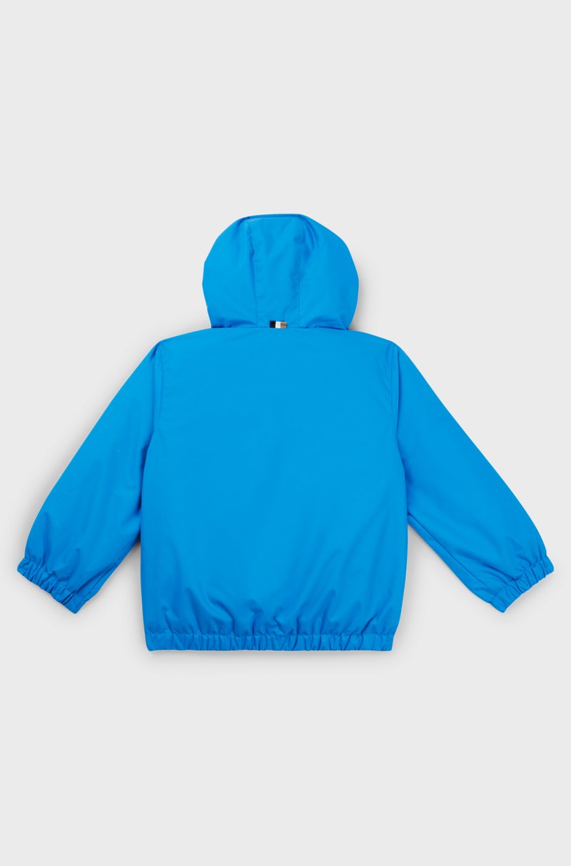 Hugo Boss Cazadora cortavientos para niños con bloques de color y estampado de monogramas que aparece con el agua Promoción trimestral